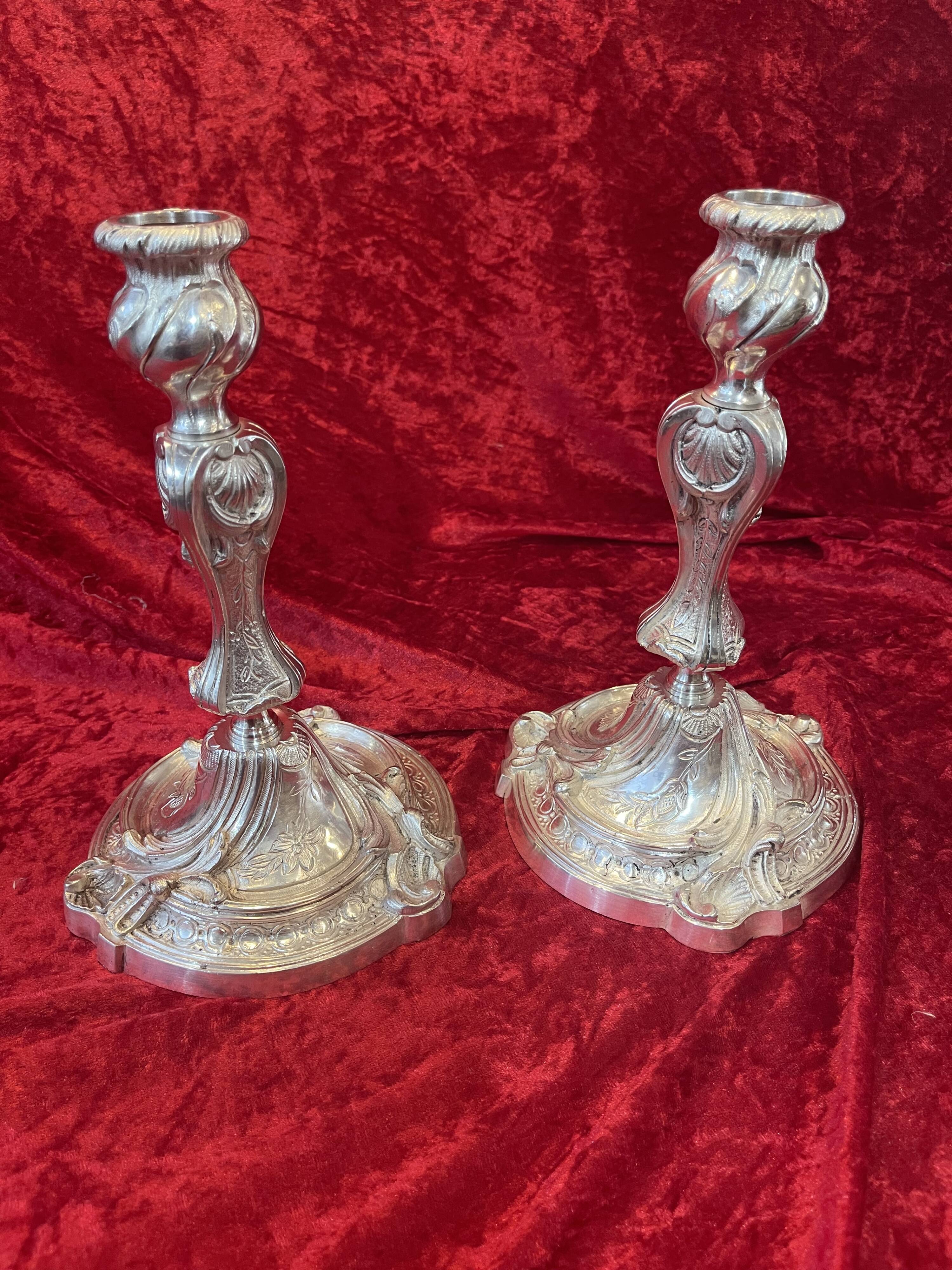 Pair of candlesticks, torches in silver bronze