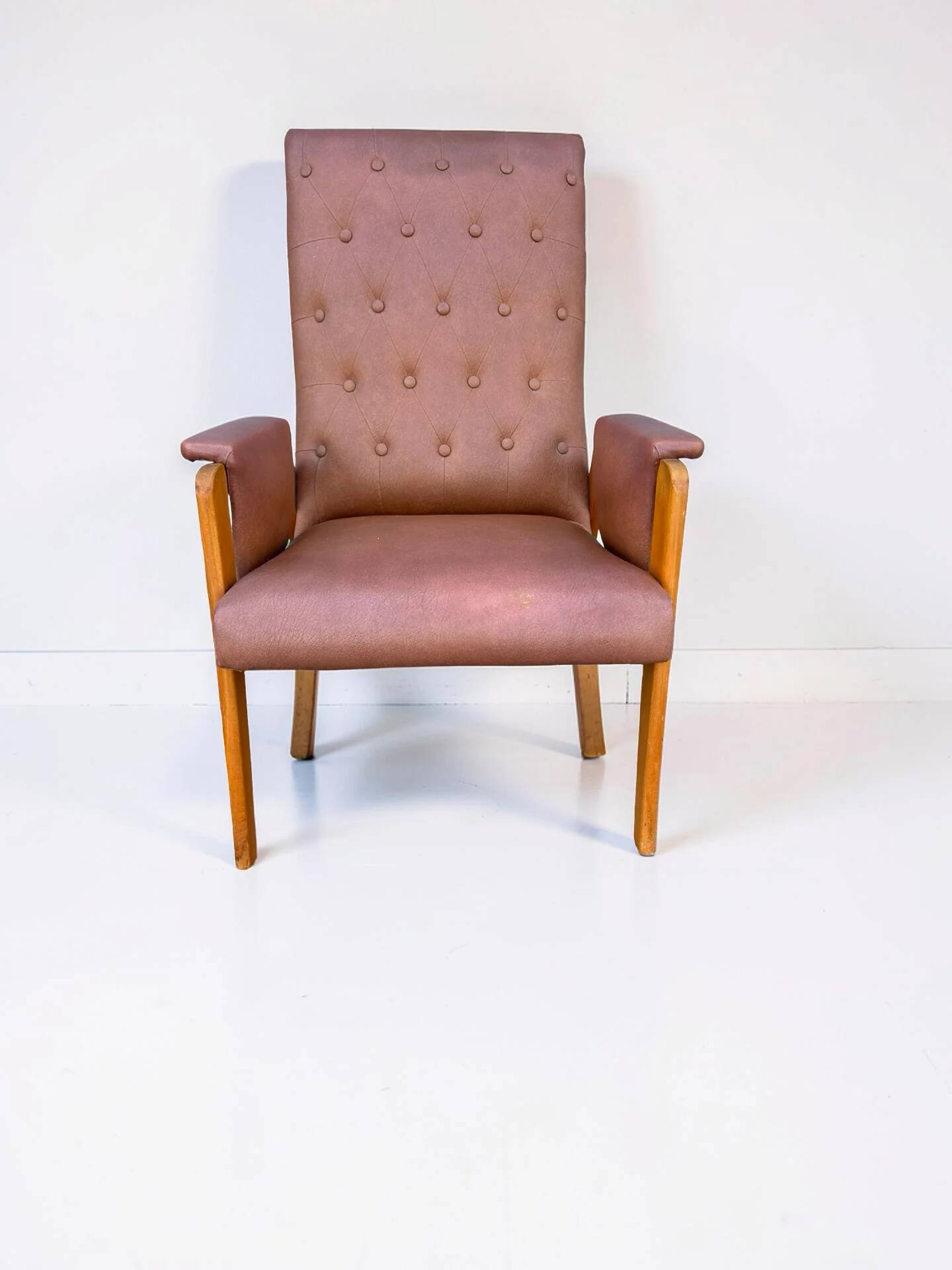 Vintage armchair in light brown faux leather, 1960s.