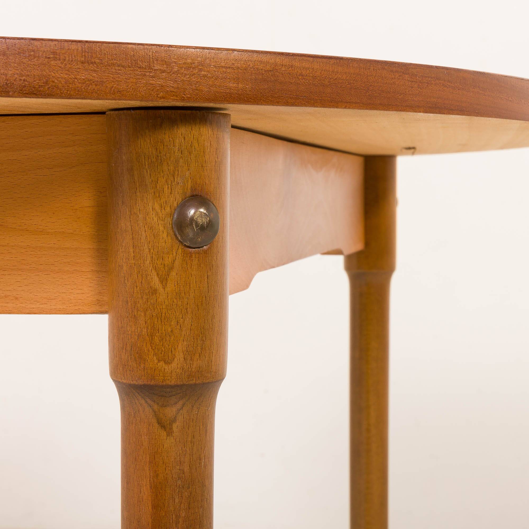 Teak round table with hidden extension, 1970s