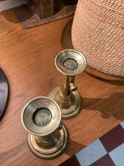 Pair of 19th-century brass pusher candlesticks