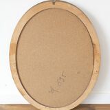 Beveled oval mirror and gilded wood frame
