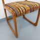 Vintage sled chair by Baumann in wood and wool fabric.
