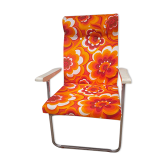 Orange folding armchair in flower year 70
