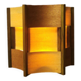 Older lamp in wood veneer, partially painted in green colour.