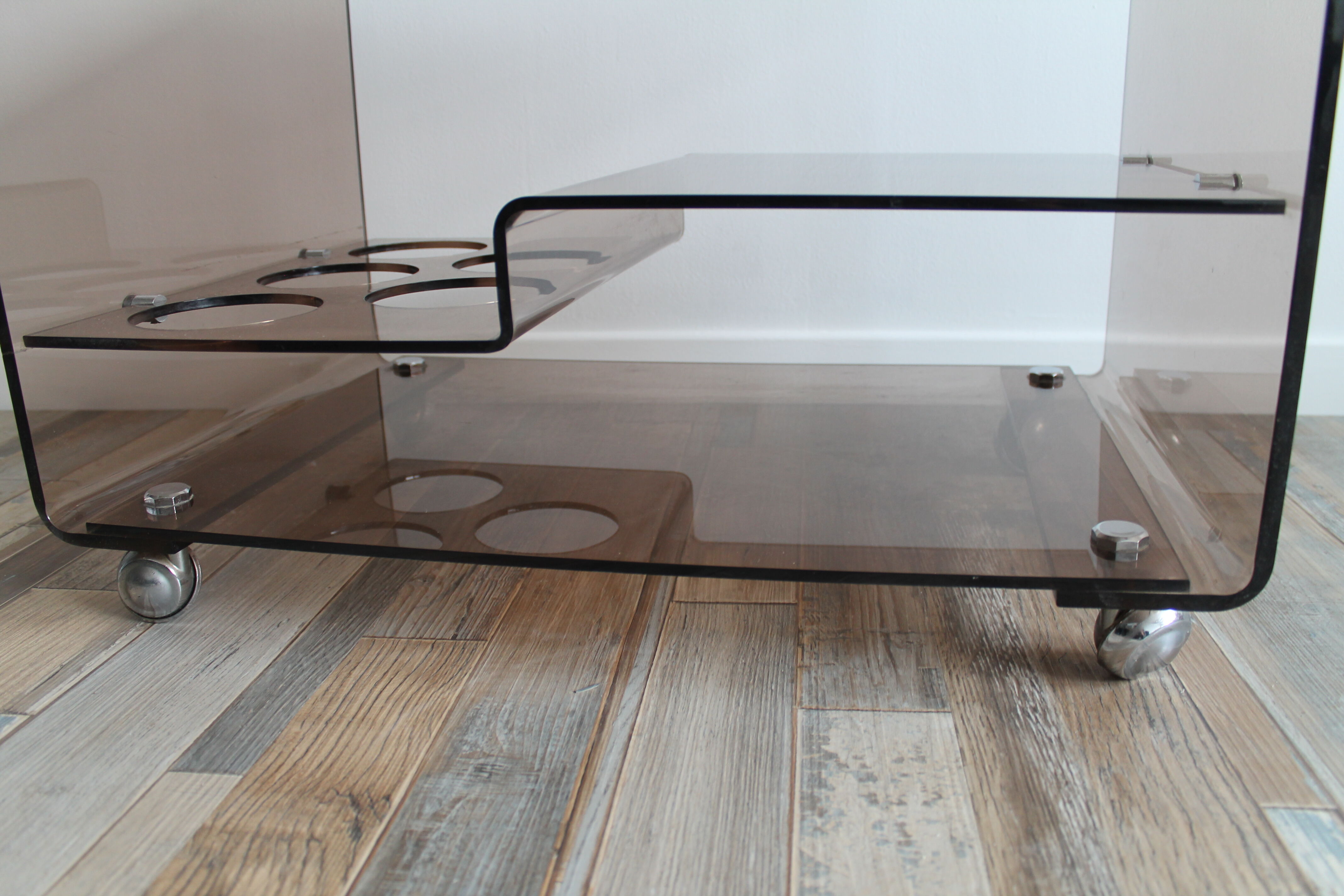 Low table served on wheels by Michel Dumas in vintage 1970 smoky Plexiglas