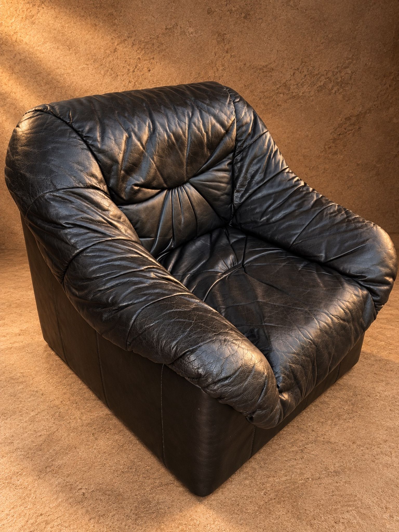 Leather armchairs and matching pouf, Italy, circa 1980