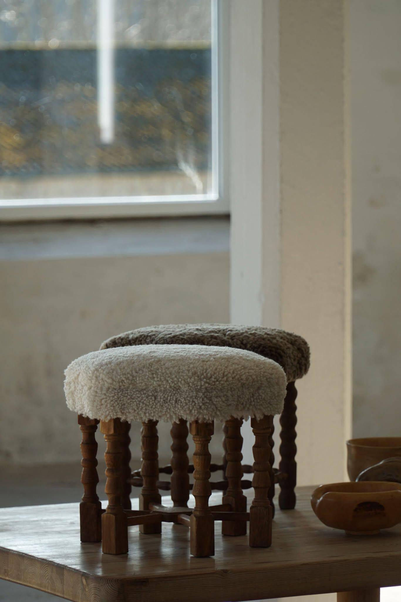 A hexagonal oak stool, seat refurbished in lambswool, Danish design from the 1950s.