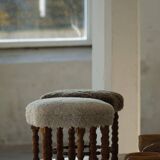 A hexagonal oak stool, seat refurbished in lambswool, Danish design from the 1950s.
