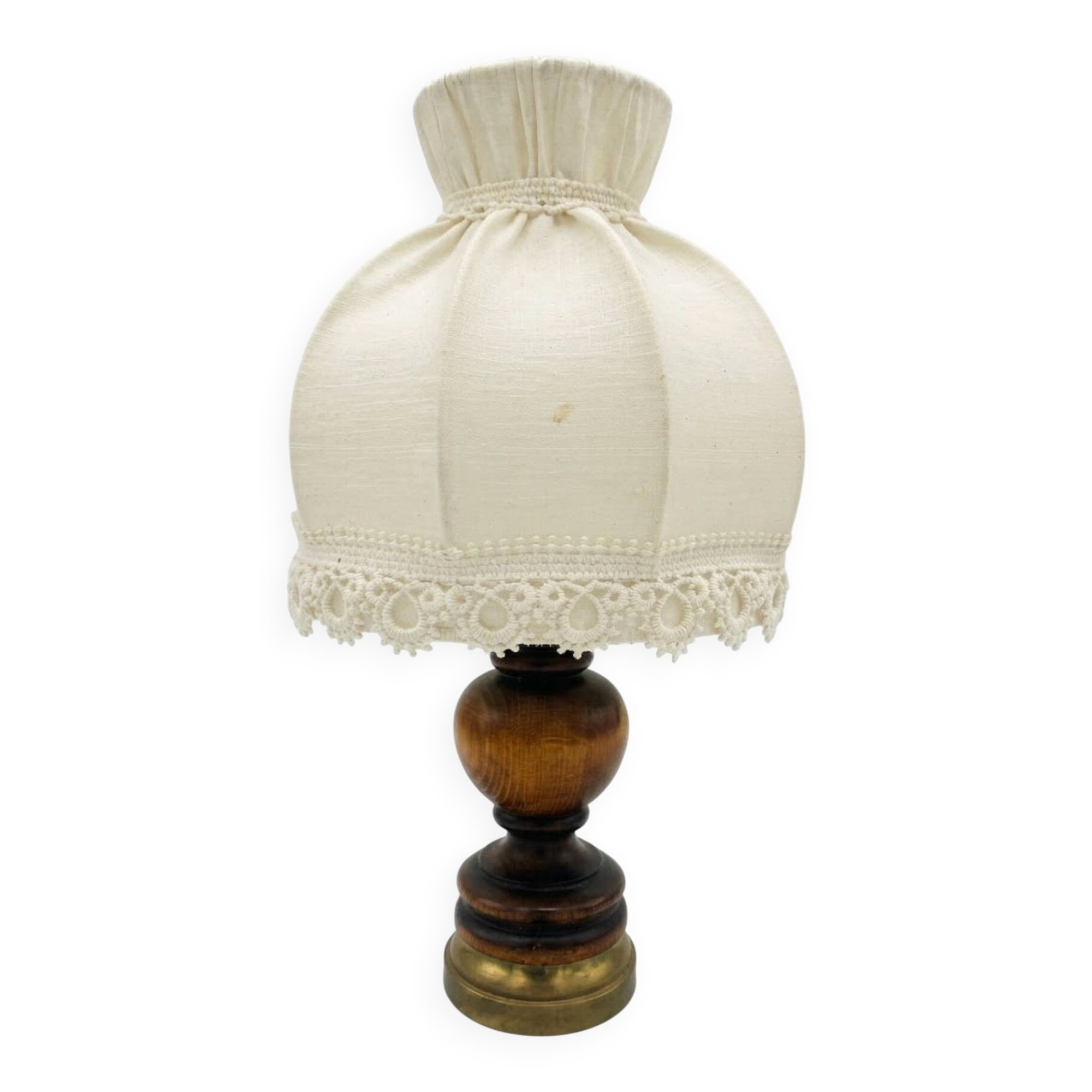 Small vintage wooden turned table lamp with a pleated shade.