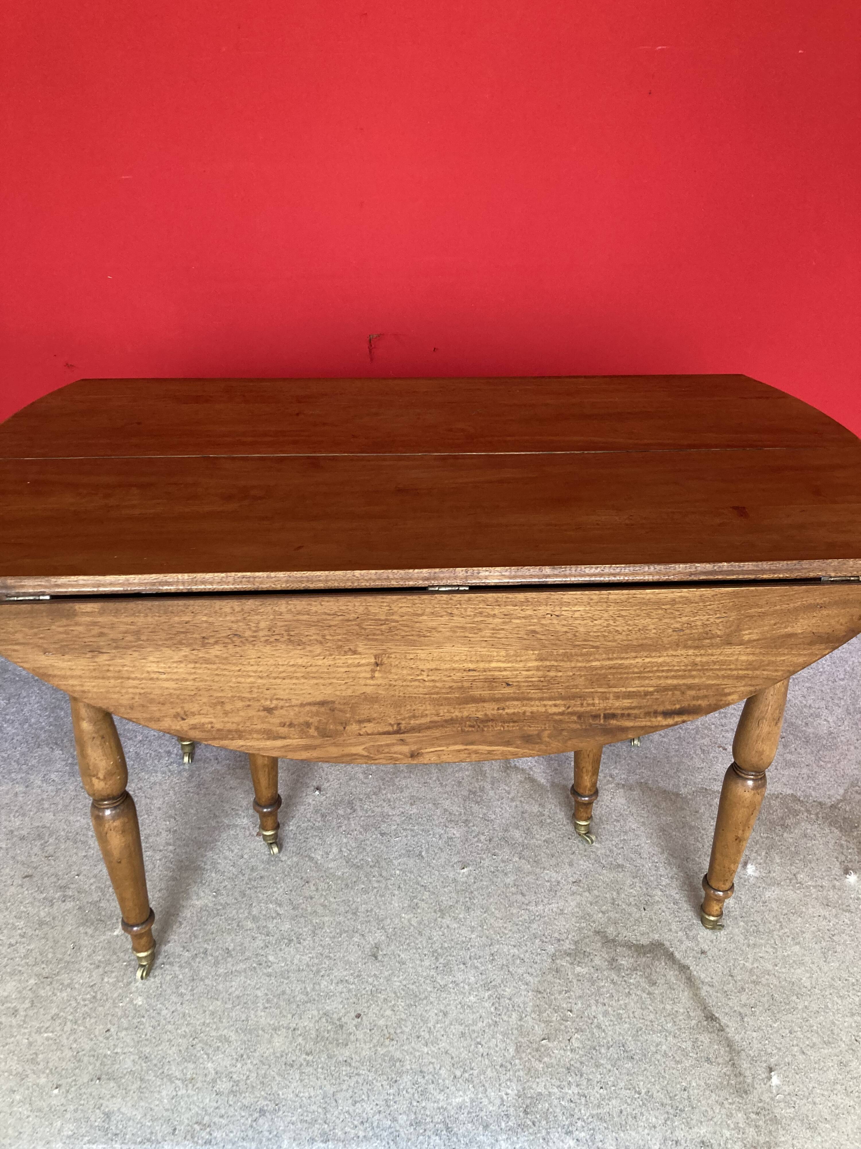 Cherry wood drop-leaf table.
