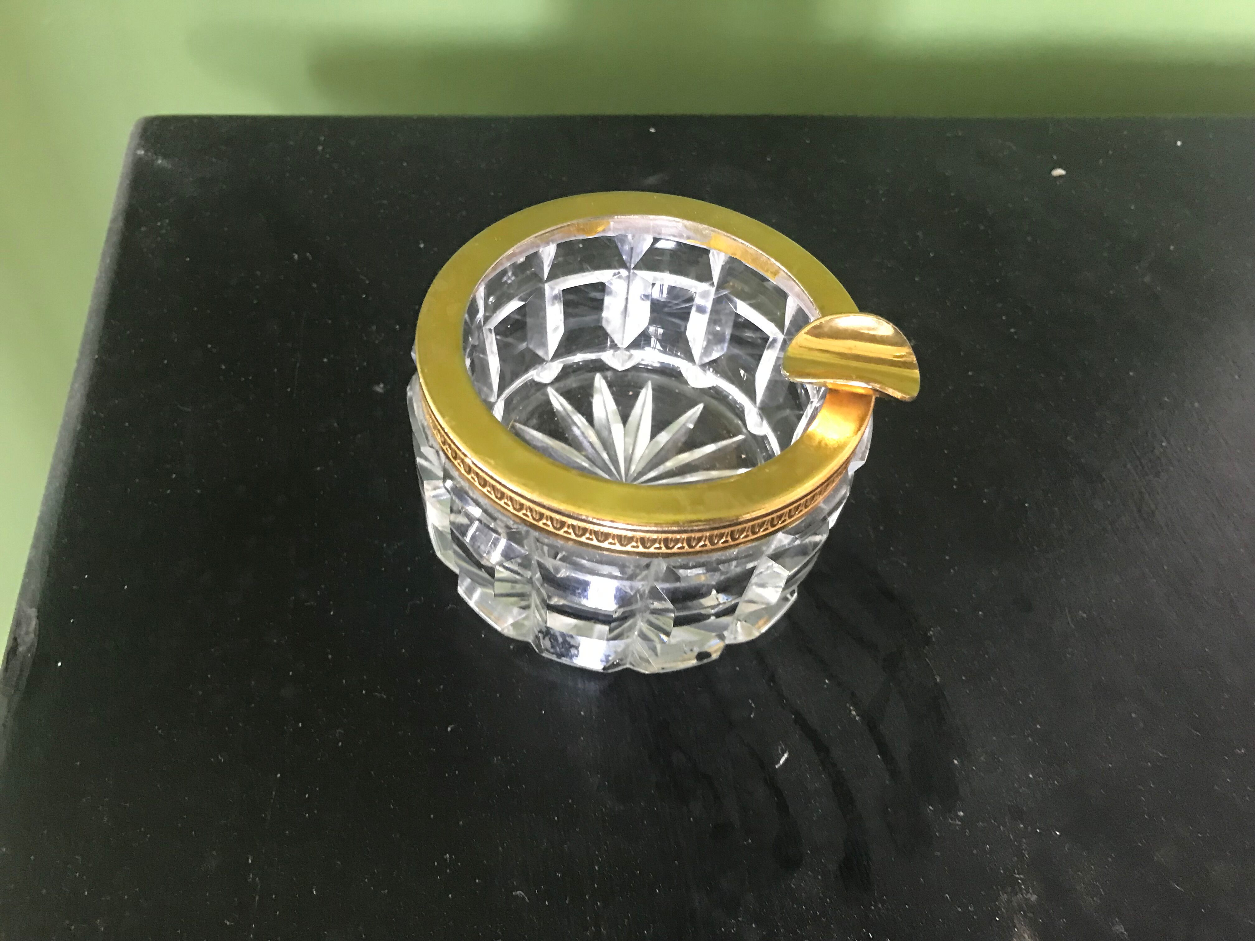 Glass ashtray and gold metal