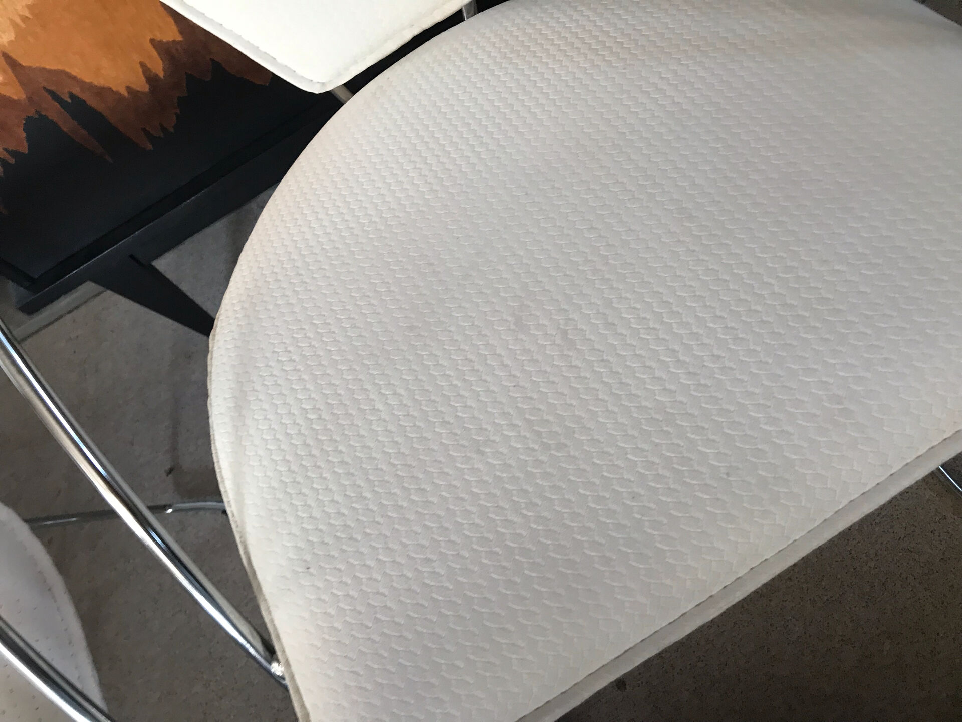 Set of two design chairs in steel and faux leather.