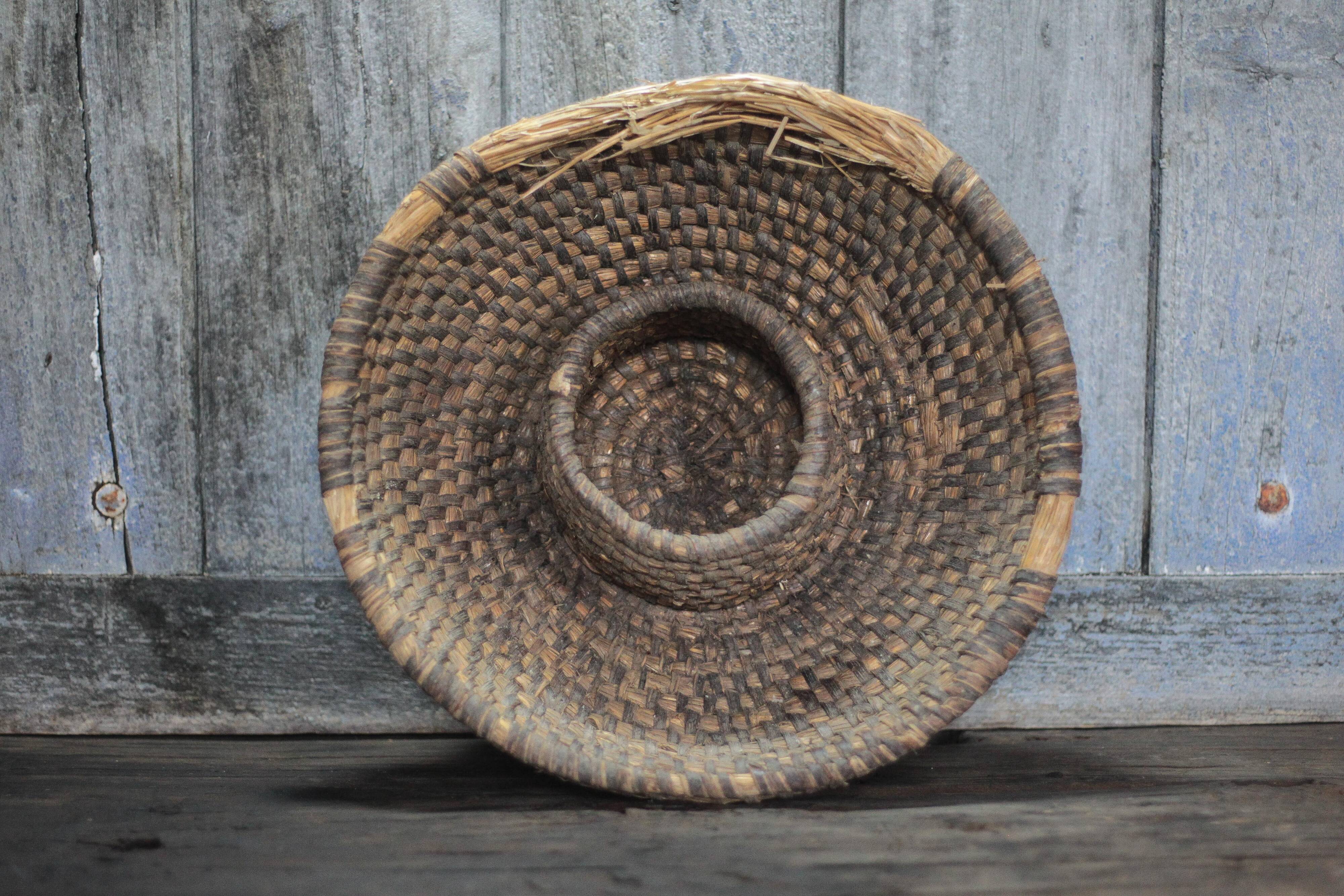 Old wicker basket, straw and bramble, woven basket, countryside.