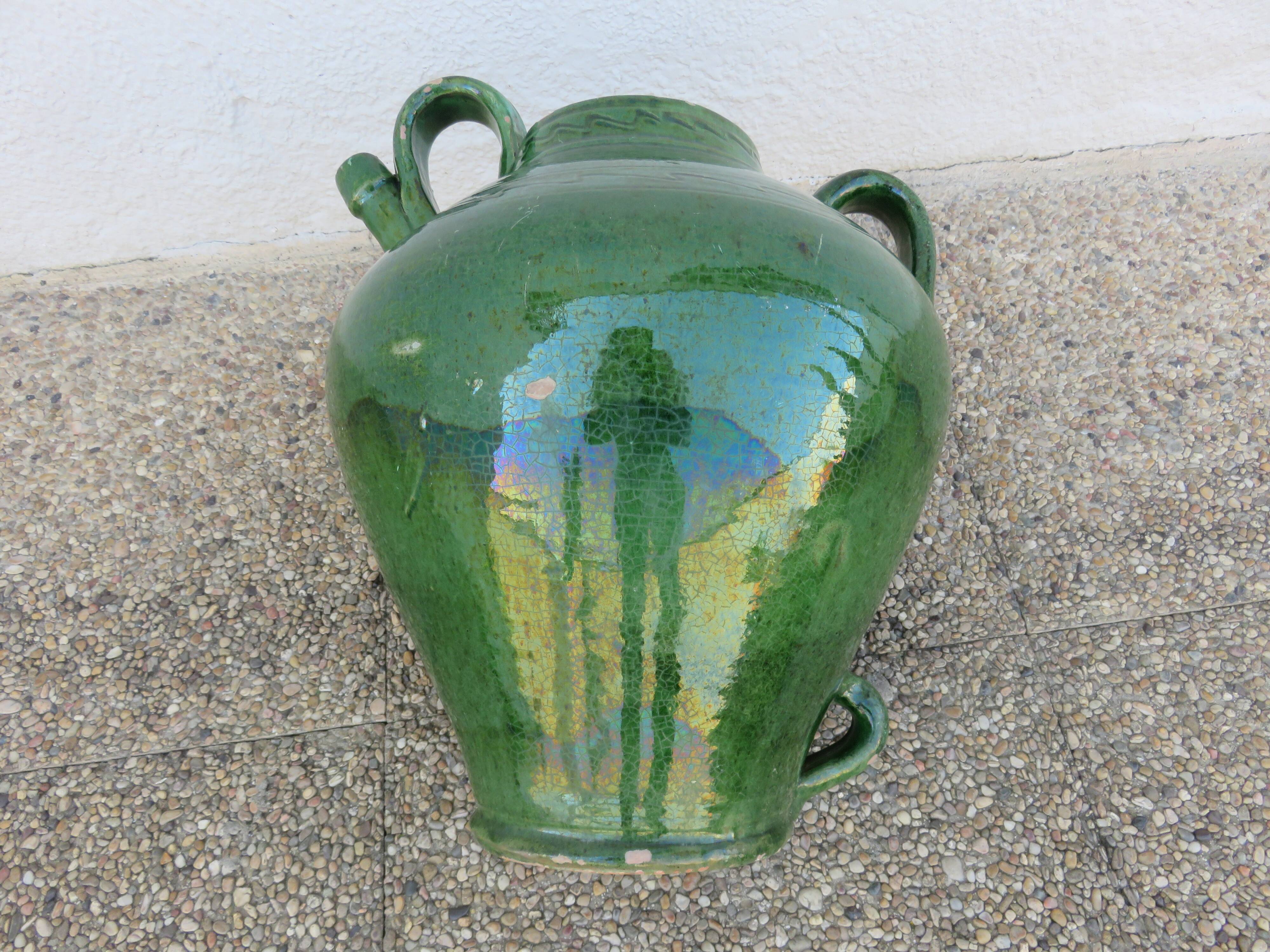 Antique glazed green terracotta oil jar, late 19th century.