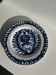 Artesania Alvarez Spanish plate in terracotta with blue plant motif.