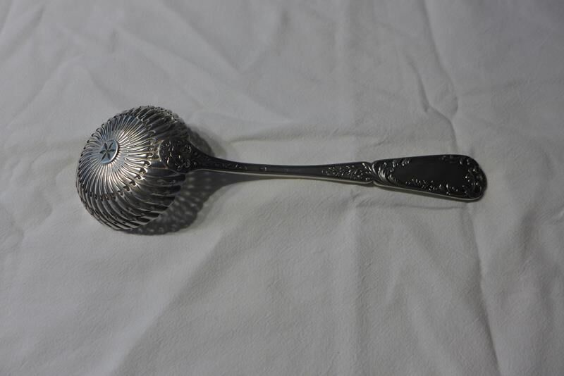 Silver sprinkler spoon