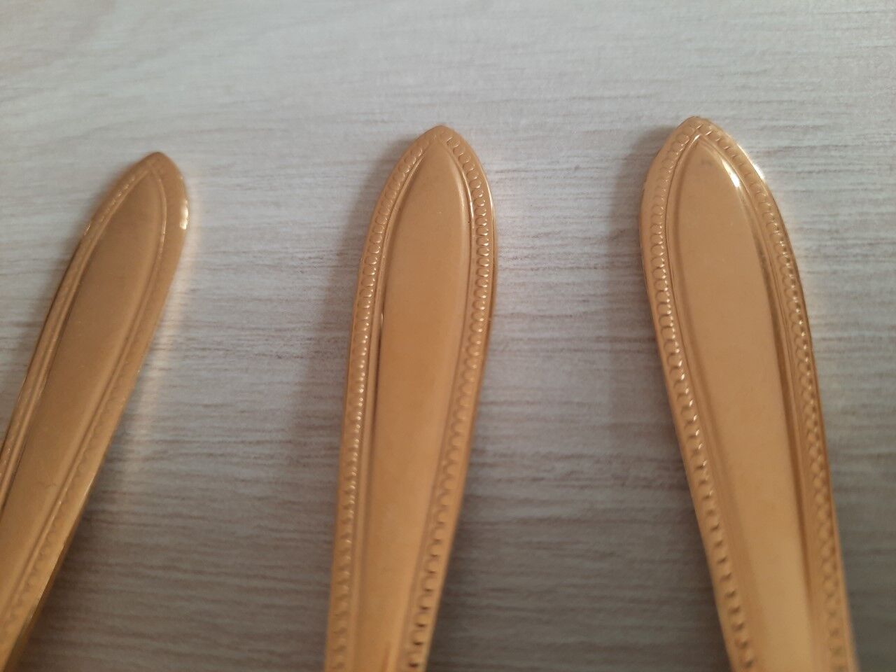 Small golden metal spoons