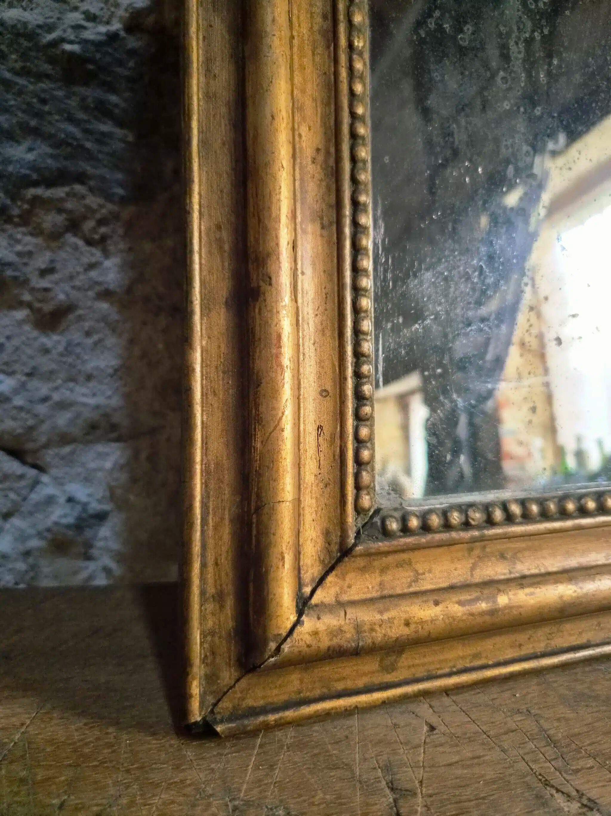 Antique French Louis Philippe mirror, gilded mercury mirror, 19th century.
