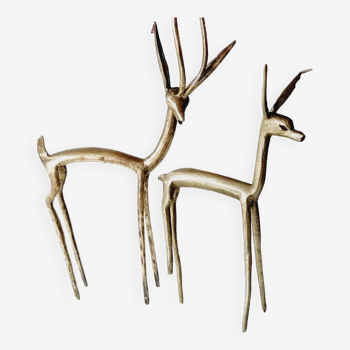 Couplé d'antilopes en laiton stylisées
