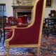 Golden wooden bergère in Louis XVI style upholstered in Bordeaux velvet.