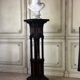 A pedestal table in blackened wood and burl veneer, superb assembly of moldings circa 1880