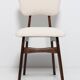 20th-century walnut and light cream boucle butterfly chair, Europe, 1960.