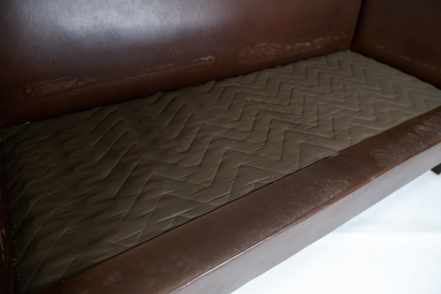 Two seater sofa upholstered with dark brown leather of danish design , by Stouby Furniture