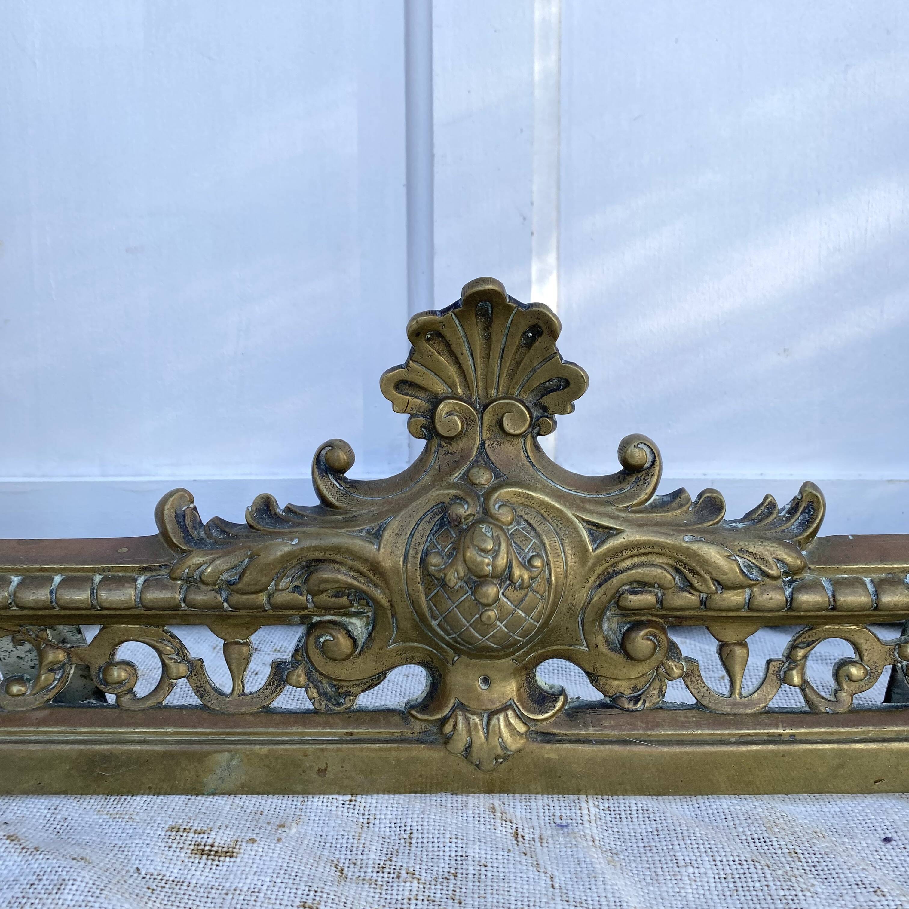 Antique brass fireplace set, bar and andirons, Napoleon I style.