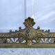 Antique brass fireplace set, bar and andirons, Napoleon I style.