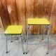 Set of 2 yellow Formica stools