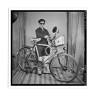 Photograph of an Indian posing with his bike