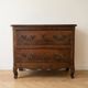 Antique walnut chest of drawers with two drawers.