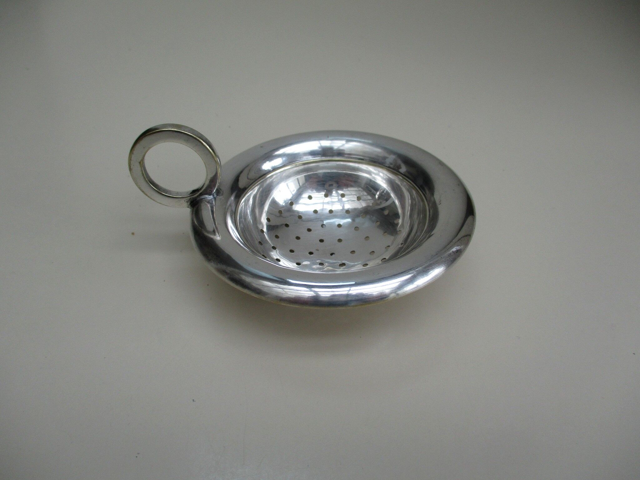 Silver metal tea strainer
