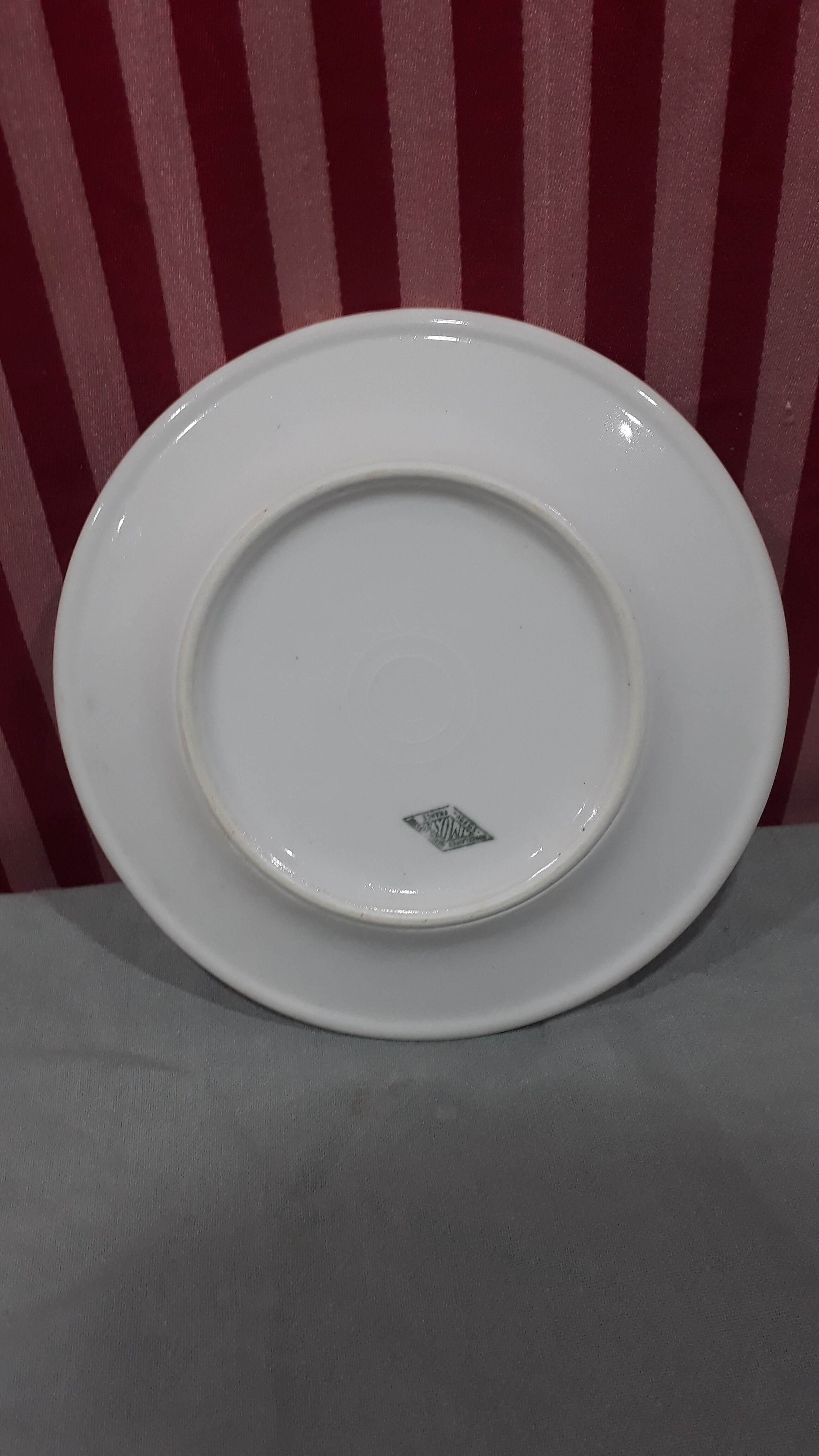 3 plates in white porcelain and green edging
