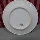 3 plates in white porcelain and green edging