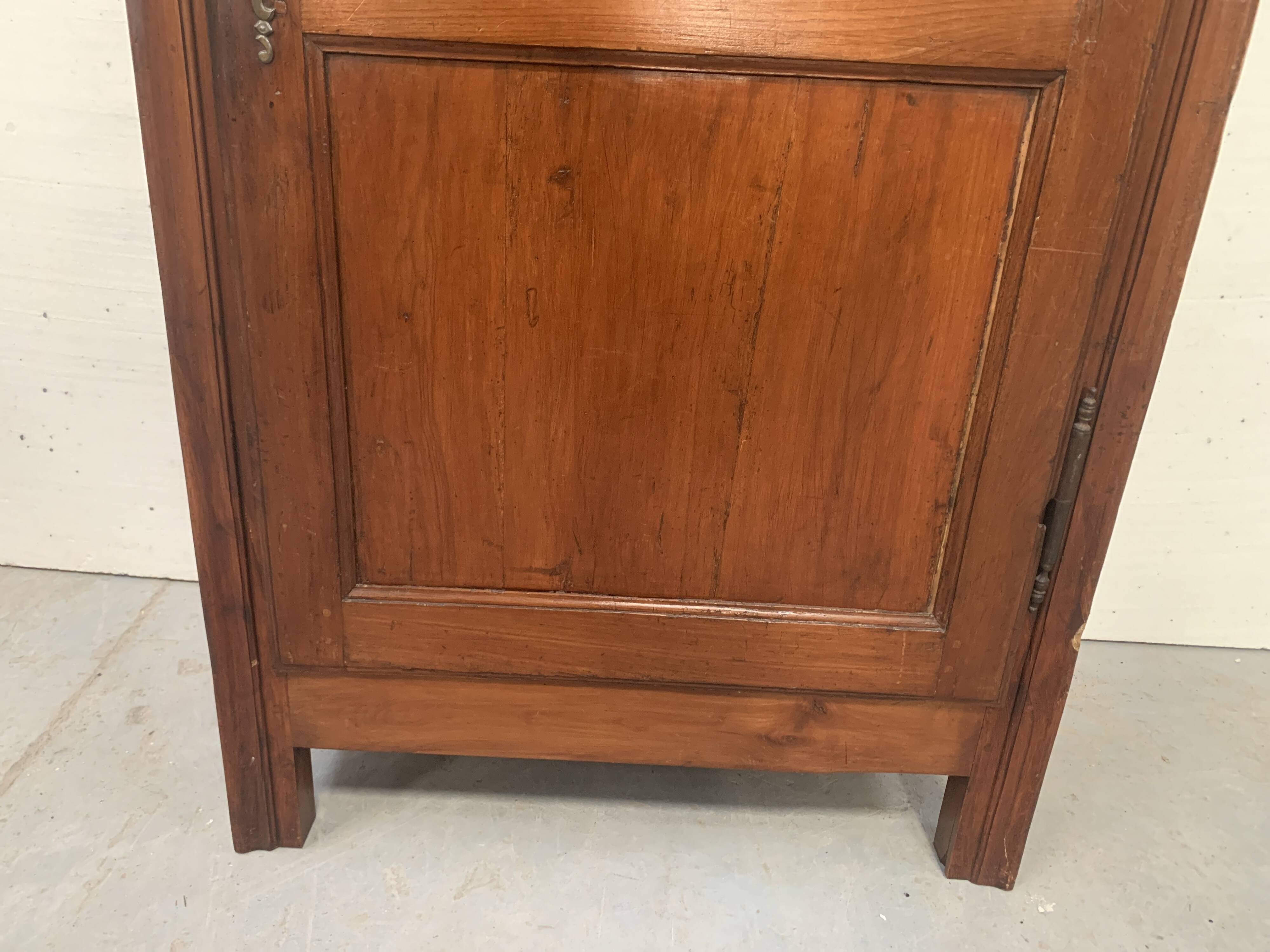 Louis Philippe style bonnetière in solid cherry wood, 19th century