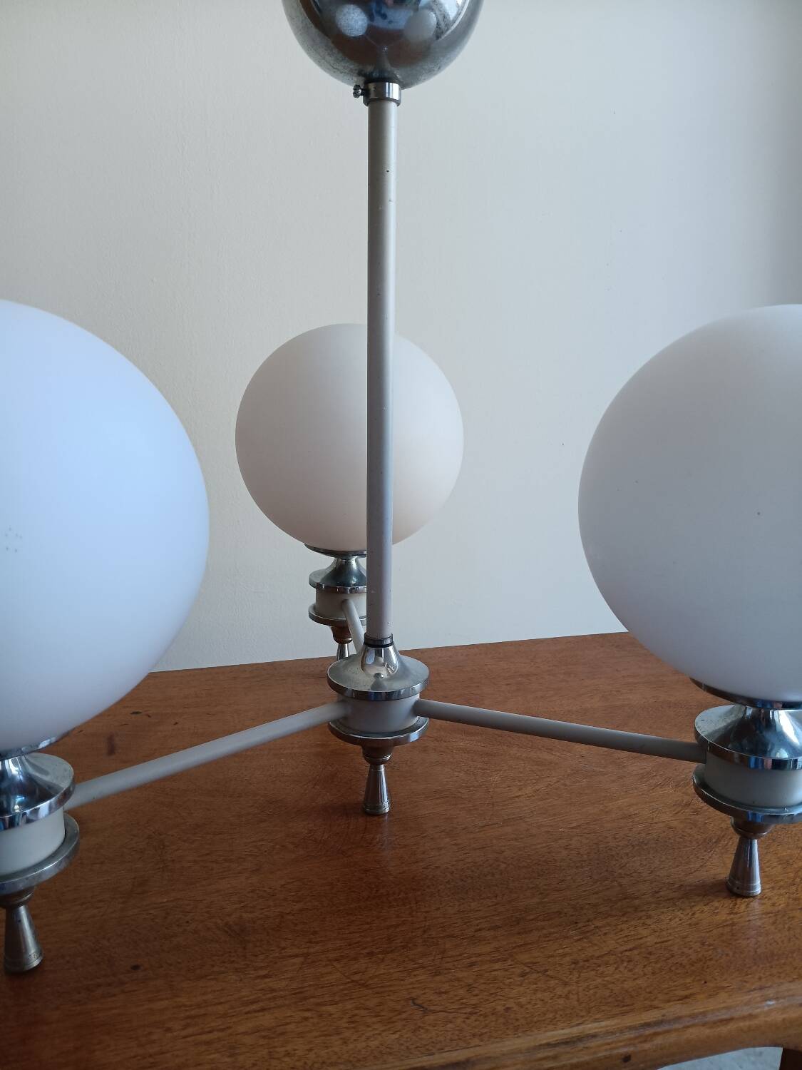 White ball and metal chandelier