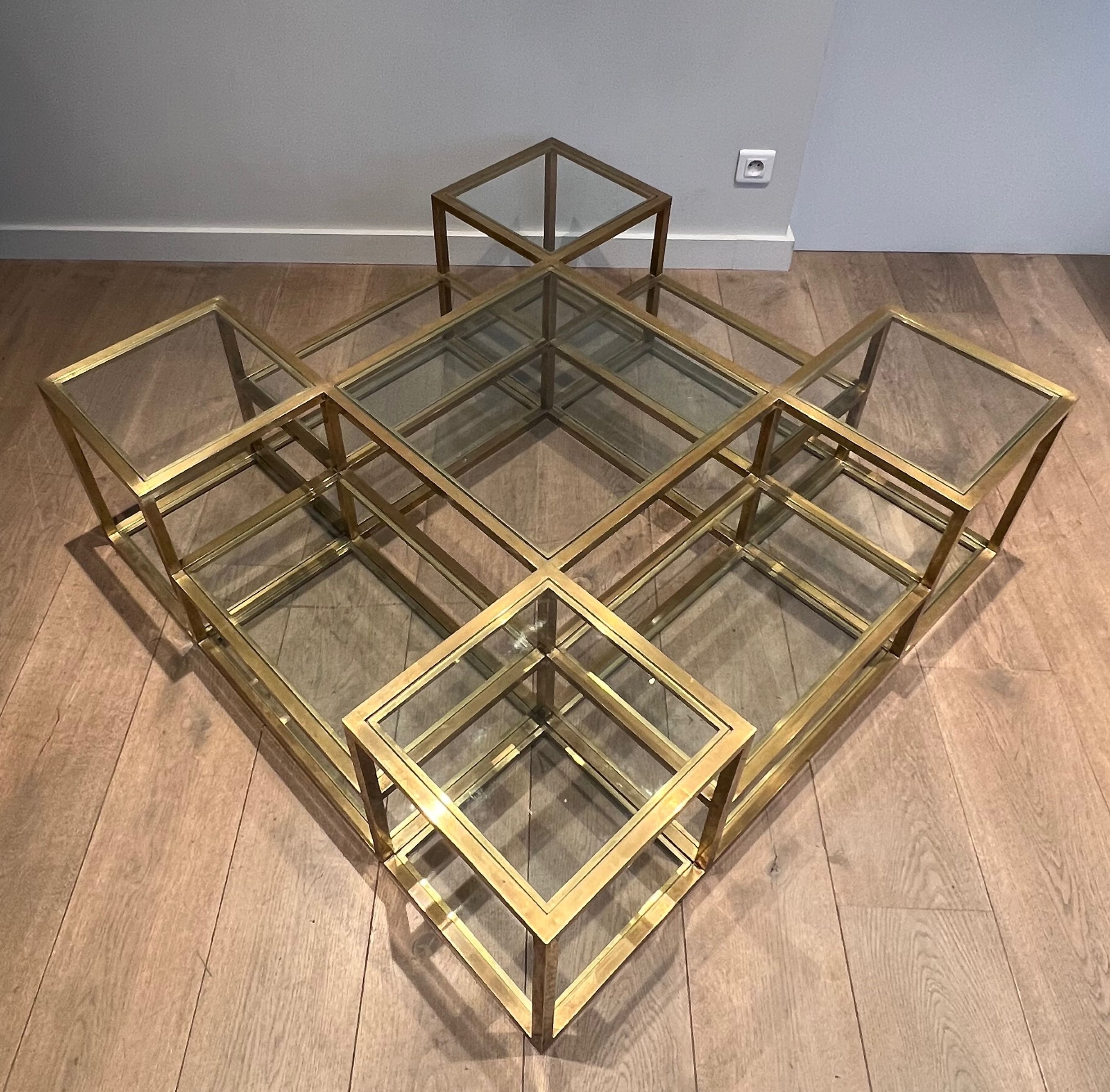 Important brass coffee table with multiple levels.