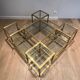 Important brass coffee table with multiple levels.