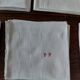 Set of seven monogram PP damask cotton napkins 56 x 56 cm