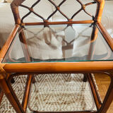 Two rattan and glass bedside tables
