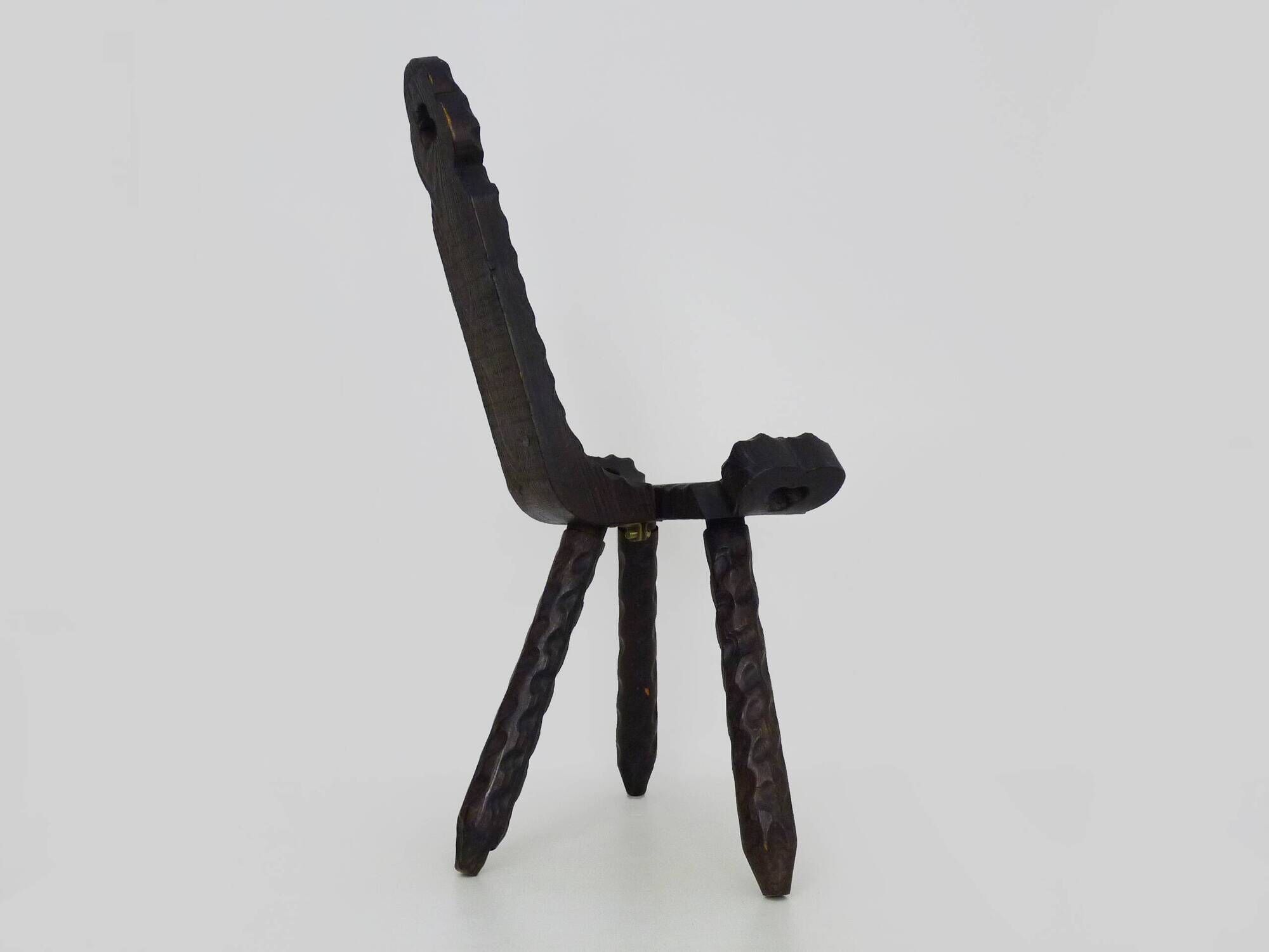 Brutalist tripod chair in raw wood. solid wood chair