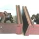 Art Deco bookends wooden elephants and bones on wooden terrace, book shape