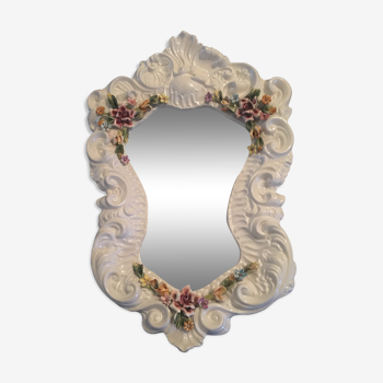 Miroir en porcelaine figurant des fleurs, signé "Bassano"