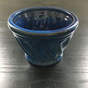 Navy blue stoneware pot.