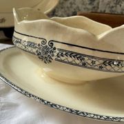 Sauceboat on a wrought iron base from Salins.