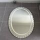 Miroir décoratif vintage ovale effet biseauté et ciselé