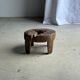 Small low circular four-legged stool in organic old teak with cut-out design H2