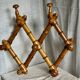 19th century turned wood accordion coat rack.