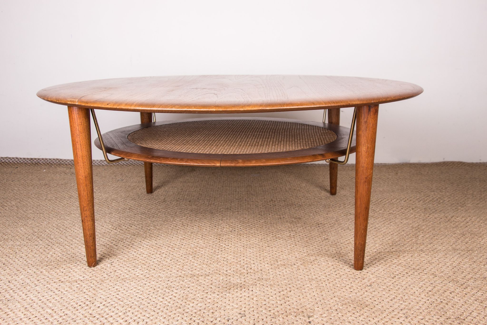 Round coffee table, two levels, danish in teak, brass and cannage